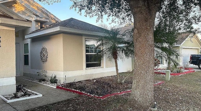 view of side of property featuring a garage