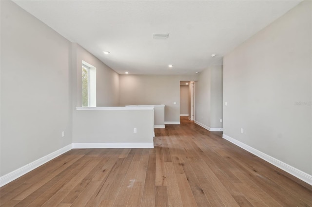 spare room with light hardwood / wood-style flooring