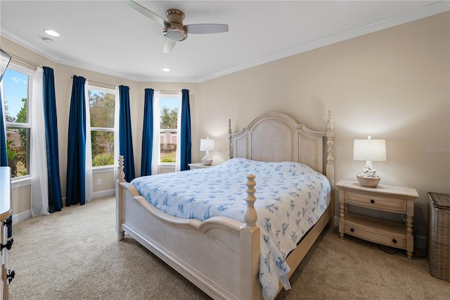 bedroom featuring ornamental molding, ceiling fan, and carpet