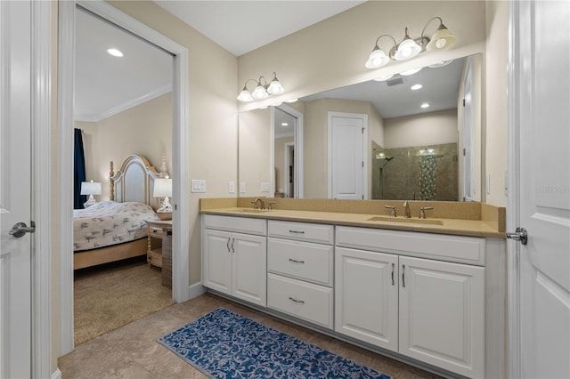 bathroom featuring vanity, crown molding, a shower with shower door, and tile patterned floors