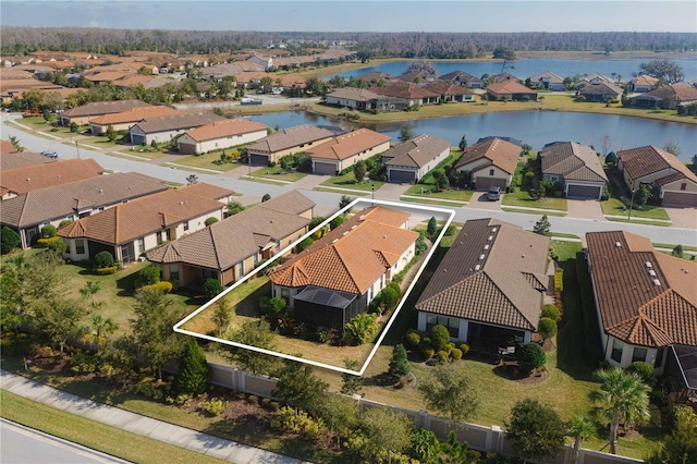 birds eye view of property with a water view