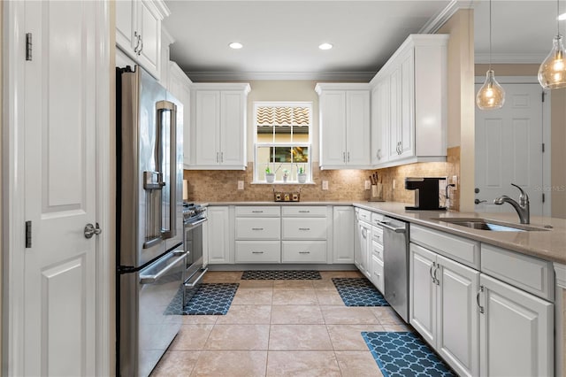 kitchen with appliances with stainless steel finishes, sink, and white cabinets