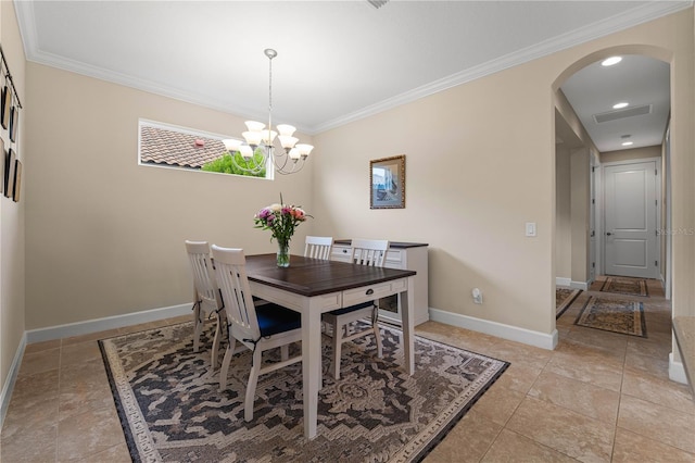 tiled dining room featuring an inviting chandelier and ornamental molding