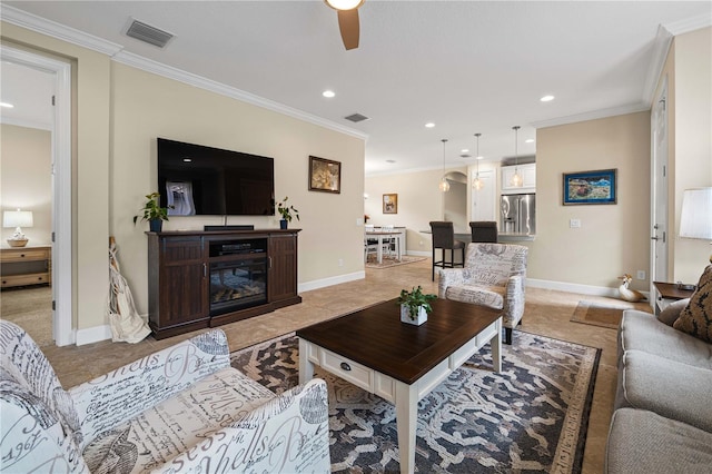 living room featuring ornamental molding and ceiling fan