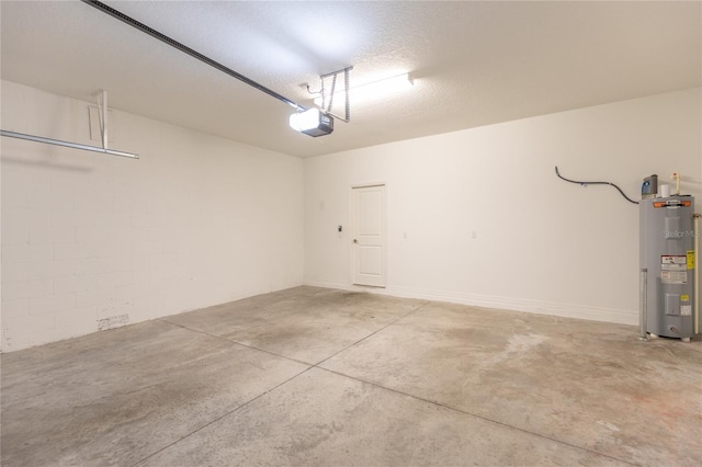 garage featuring a garage door opener and electric water heater