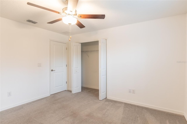 unfurnished bedroom with baseboards, visible vents, and light colored carpet