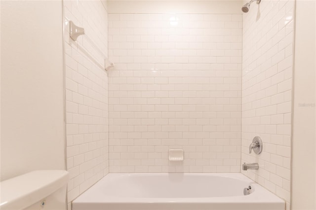 bathroom featuring  shower combination and toilet