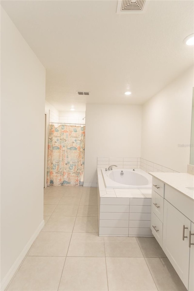 full bathroom with visible vents, a garden tub, vanity, and tile patterned floors