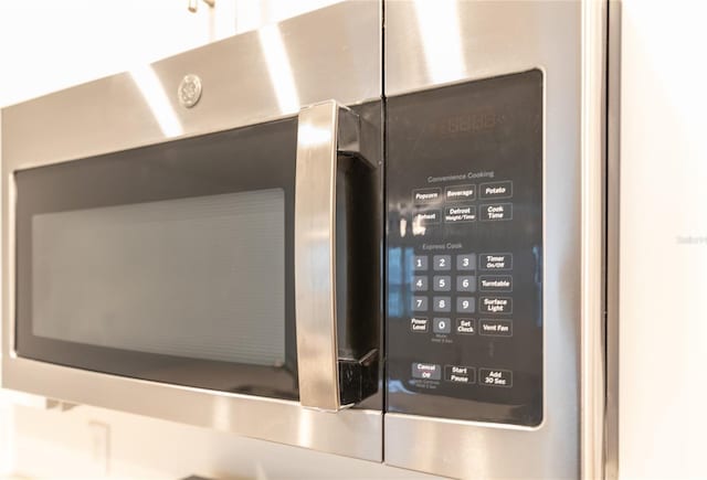 interior details featuring stainless steel microwave