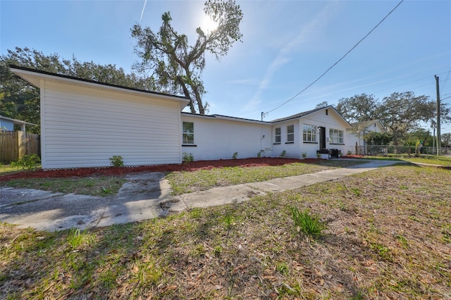 view of home's exterior with a yard