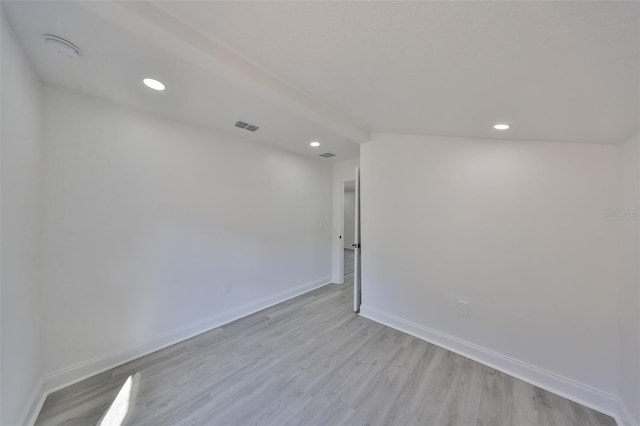 spare room featuring light wood-type flooring