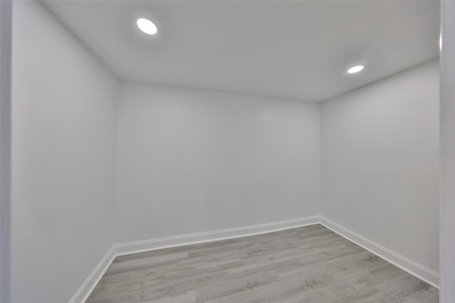 unfurnished room with light wood-type flooring