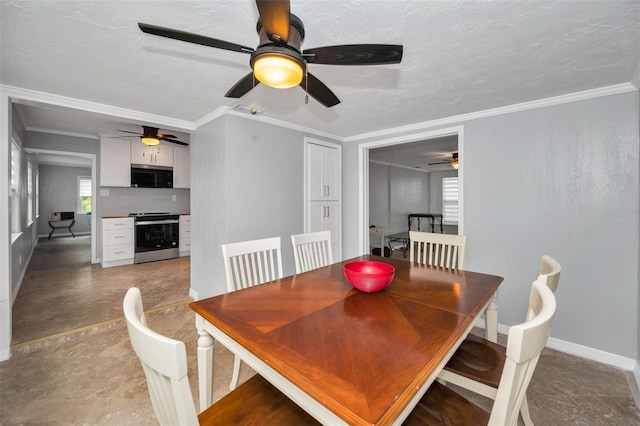 dining space with ornamental molding and a textured ceiling