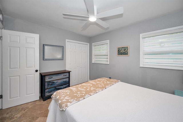 bedroom featuring a closet and ceiling fan