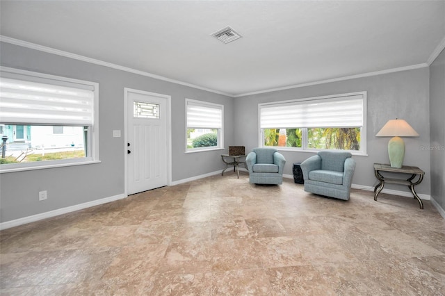 living area featuring crown molding