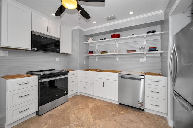 kitchen featuring ceiling fan, crown molding, white cabinets, and appliances with stainless steel finishes