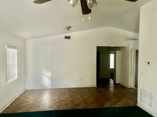 spare room with vaulted ceiling and ceiling fan