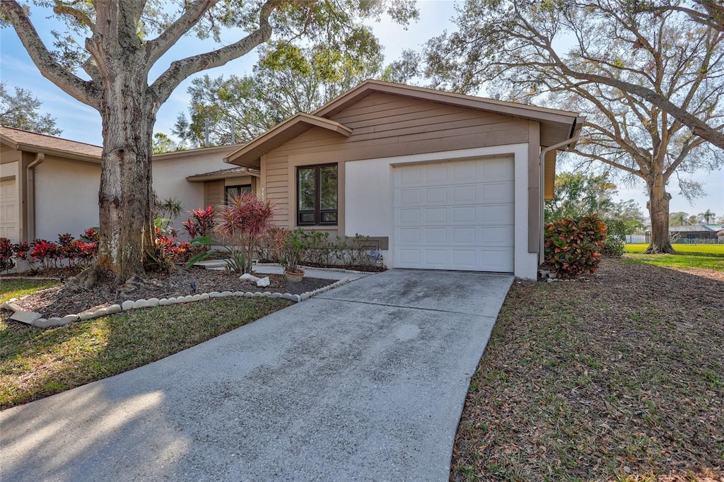 ranch-style home featuring a garage