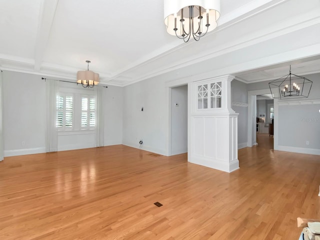 unfurnished living room with a notable chandelier, beam ceiling, and light hardwood / wood-style flooring