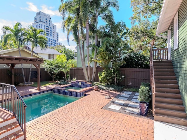 view of swimming pool with an in ground hot tub, a patio, and a gazebo