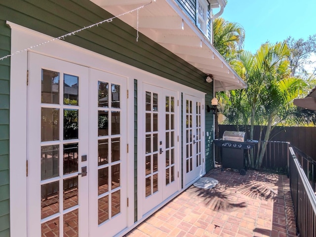 view of side of home with french doors and a patio