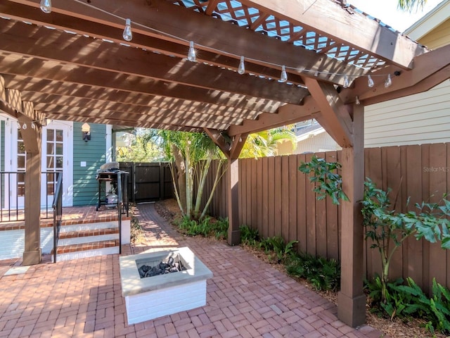 view of patio / terrace featuring a pergola and an outdoor fire pit