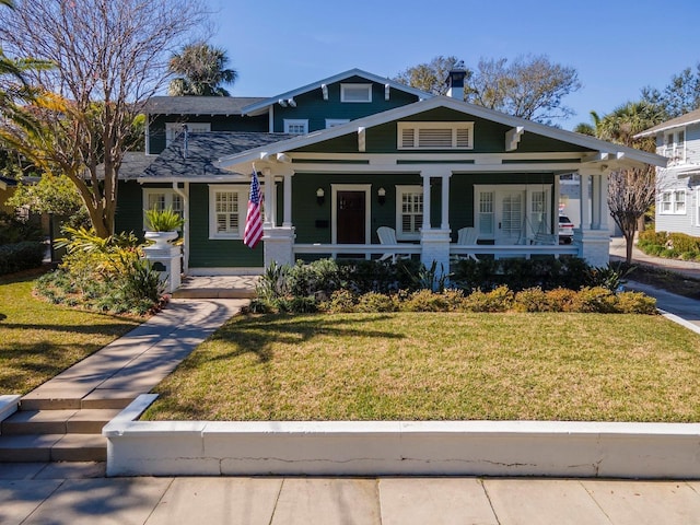 view of front facade with a porch and a front yard