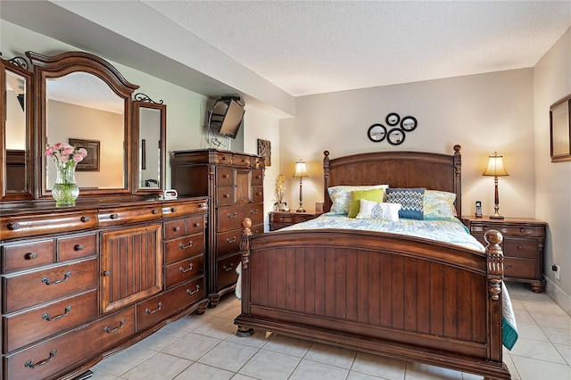 tiled bedroom with a textured ceiling