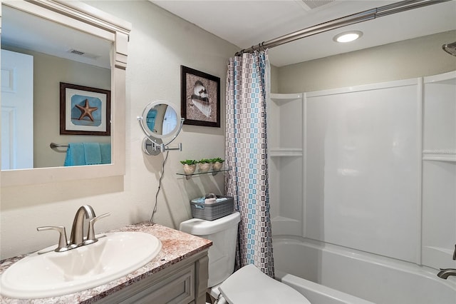 full bathroom with vanity, shower / bathtub combination with curtain, and toilet