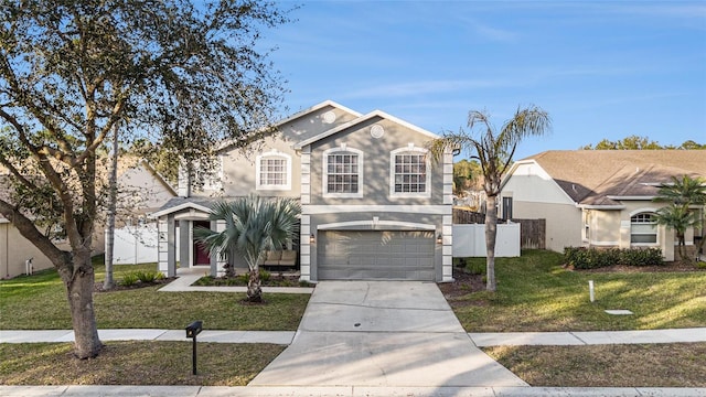 front of property featuring a garage and a front lawn