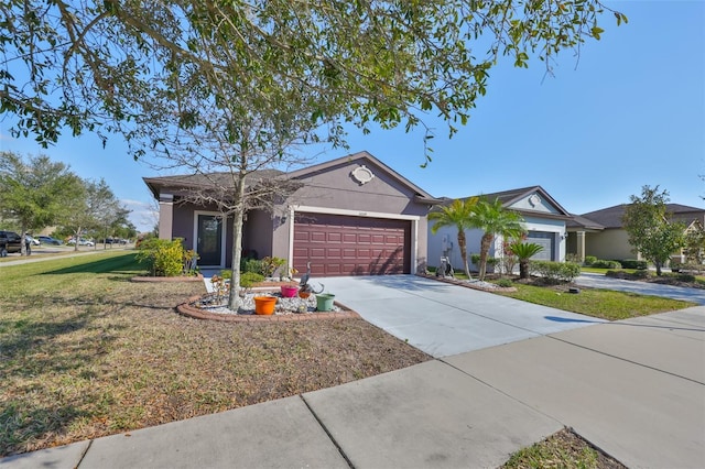 ranch-style house featuring a garage and a front yard