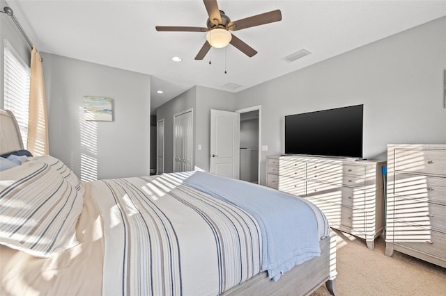 carpeted bedroom featuring ceiling fan