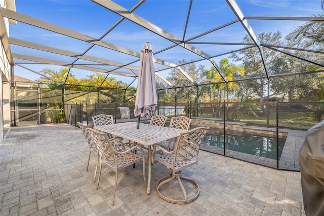 view of patio featuring a fenced in pool and glass enclosure