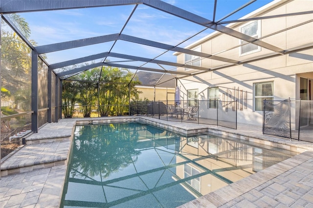 view of swimming pool with a lanai and a patio area