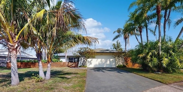 view of front facade with a garage and a front yard