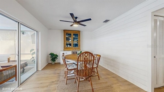 dining area featuring ceiling fan and light wood-type flooring