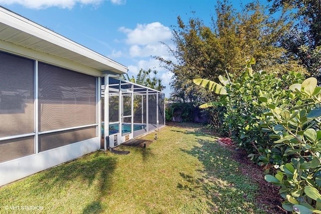 view of yard featuring a lanai