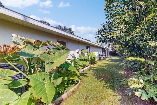 view of property exterior featuring a yard