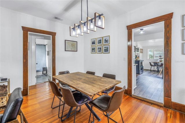 dining area featuring light wood-type flooring