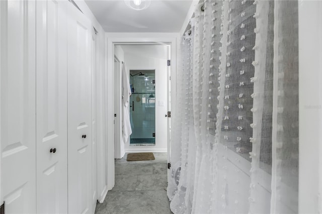 corridor with light tile patterned floors