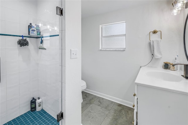 bathroom with vanity, toilet, and a shower with shower door