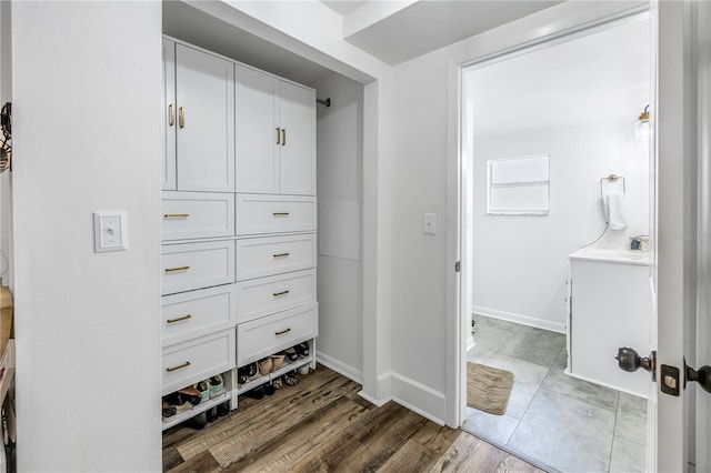 spacious closet with hardwood / wood-style floors