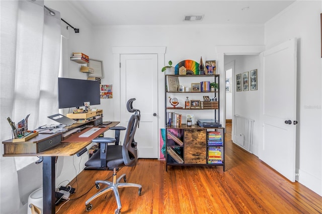 office with hardwood / wood-style flooring