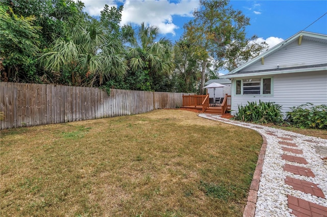 view of yard featuring a wooden deck