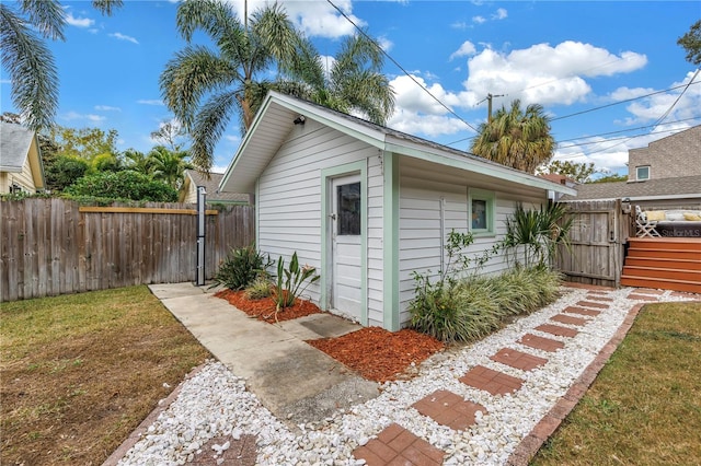 view of outbuilding with a lawn