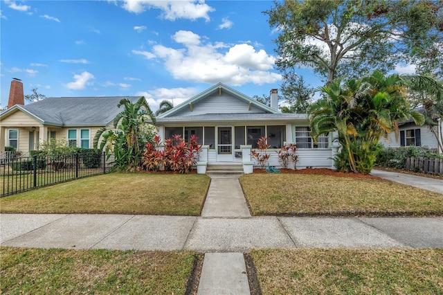 view of front of home with a front lawn and a porch