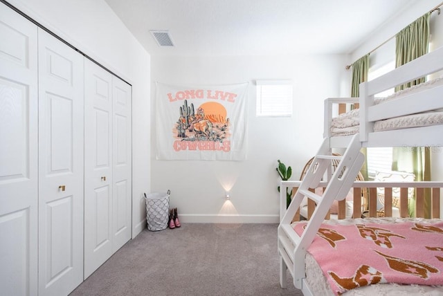 bedroom with light colored carpet and a closet