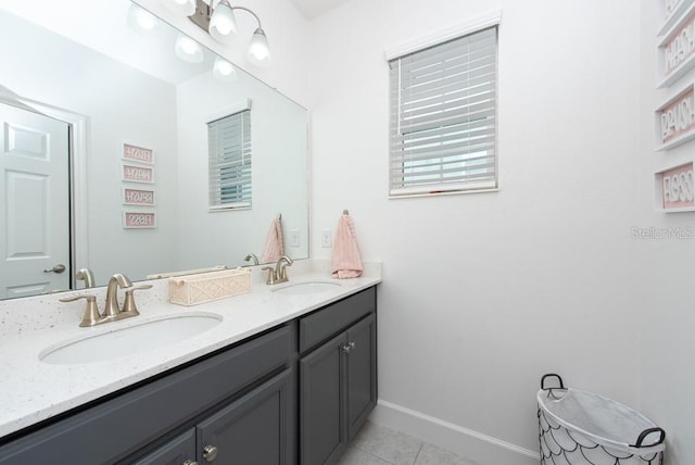 bathroom with tile patterned floors and vanity