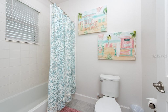 bathroom with shower / tub combo with curtain, tile patterned flooring, and toilet