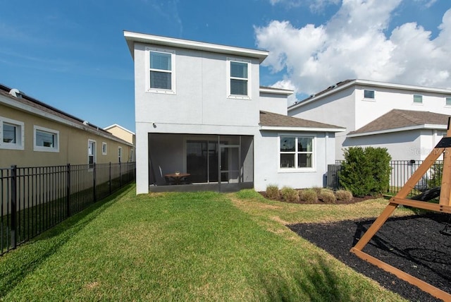 rear view of property featuring central AC, a lawn, and a sunroom